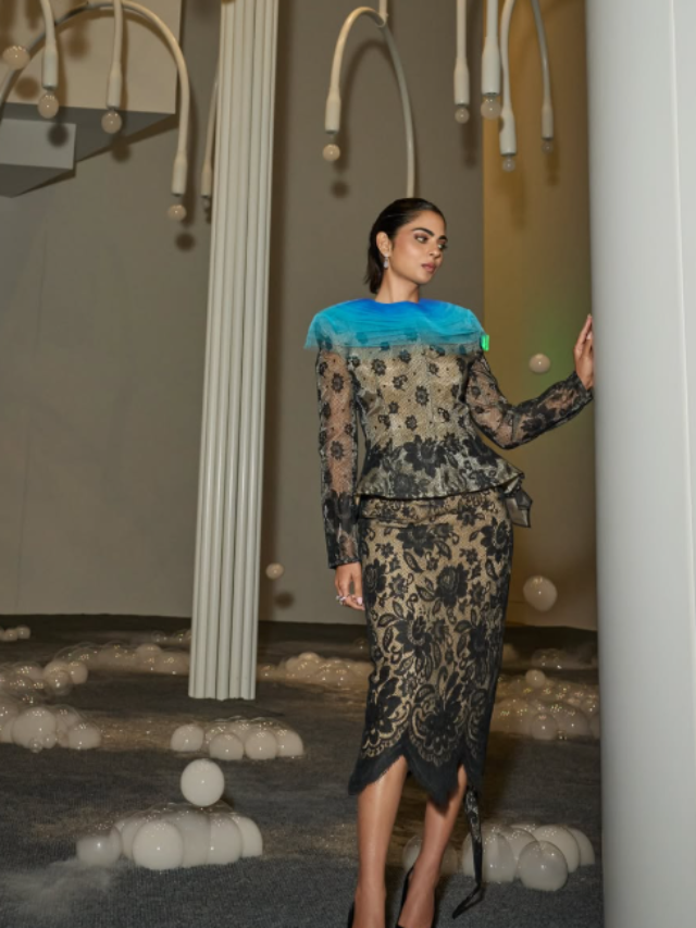 Isha Ambani looks stunning in a black lace dress with a blue ombre neckline.